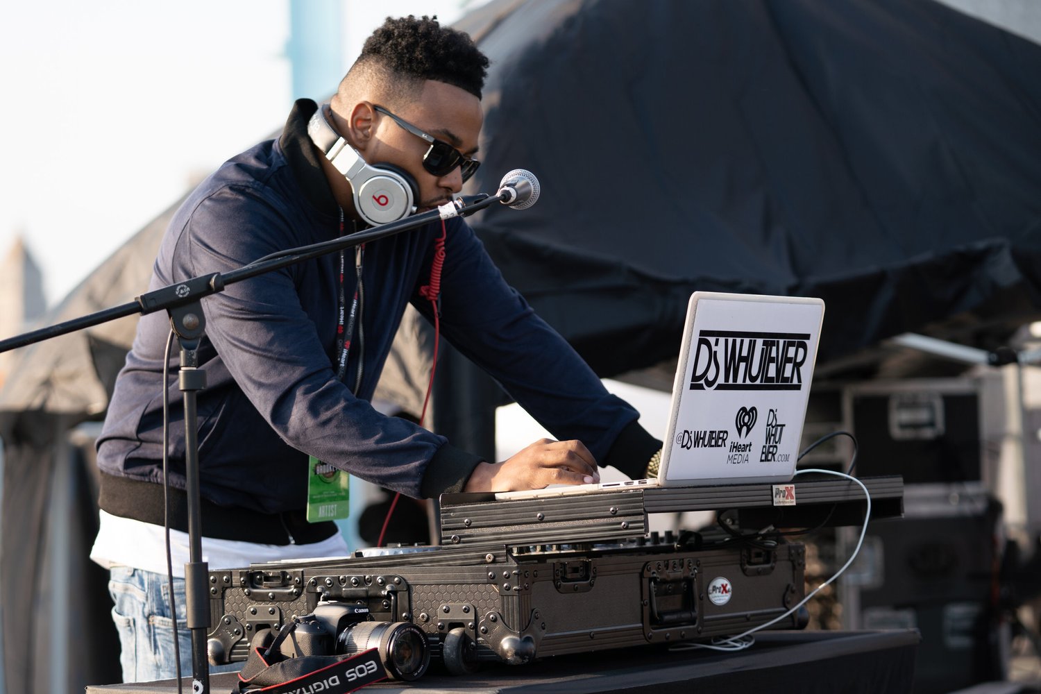 DJ performing at an outdoor Wizard Studios event