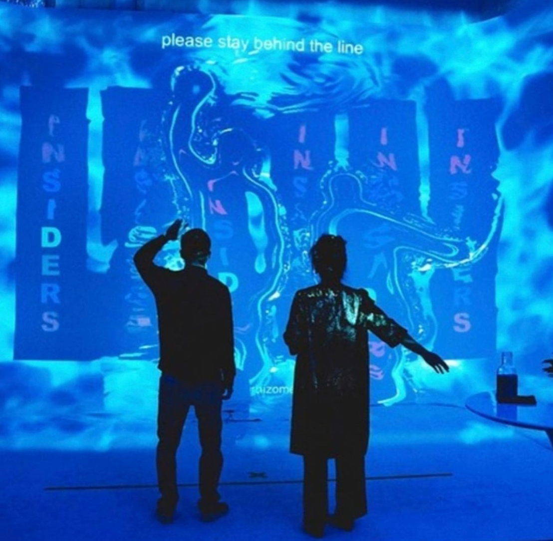 Large-format blue stage display at a live event