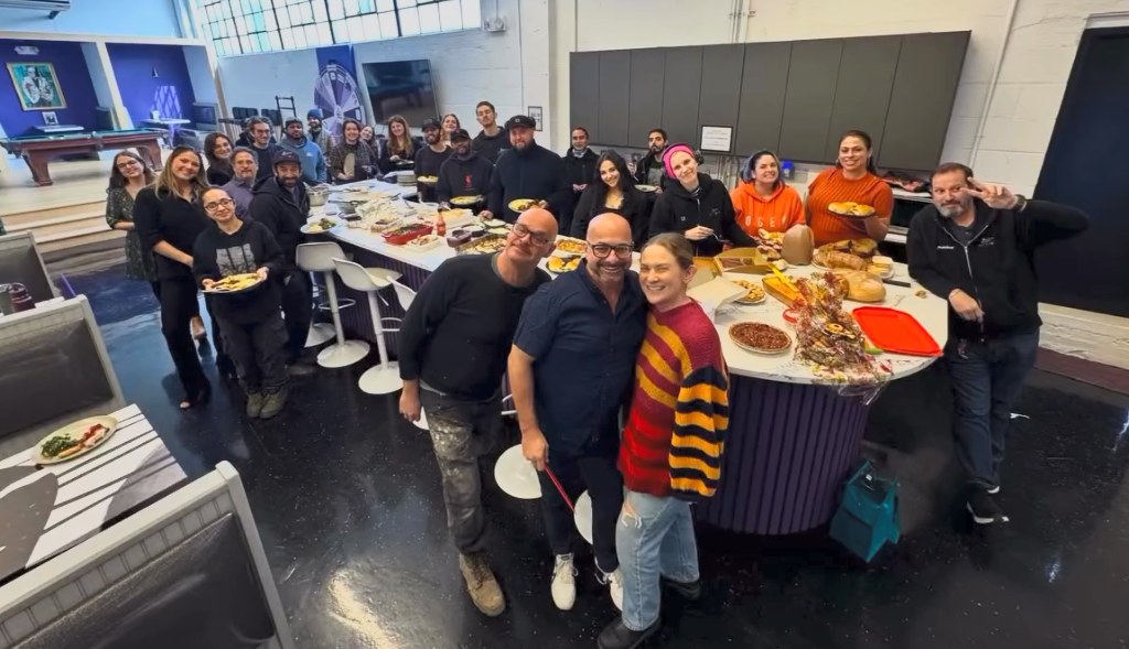 The Wizard Studios team together at their Thanksgiving table in the Astoria shop